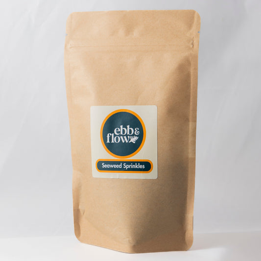 Large bag of wild Irish seaweed sprinkles on a white background