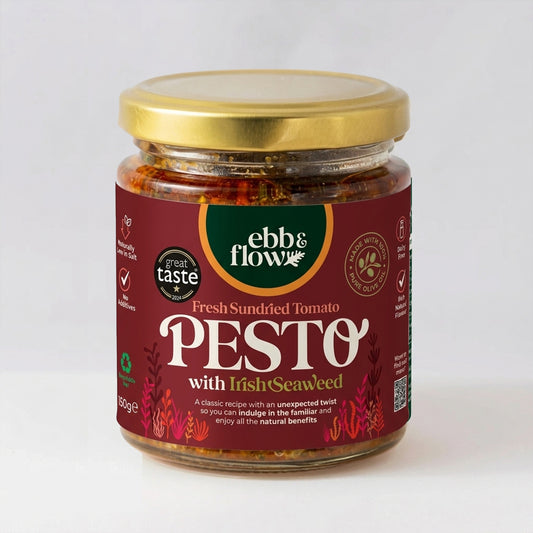 Jar of Fresh Sundried Tomato Red Pesto with Irish seaweed with a gold lid on a white background